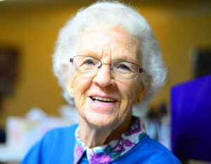 White-haired elderly woman with glasses. Asheville aging in place.