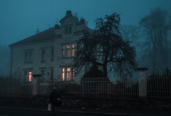 Lit up house at dusk. Home inspection myths.