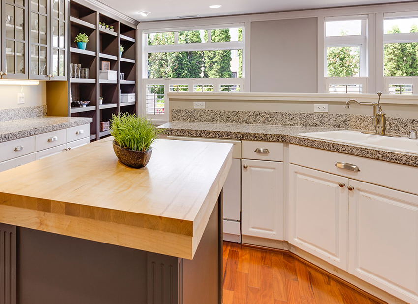 Kitchen with center island and speckled granite countertops.
Asheville home's market value.